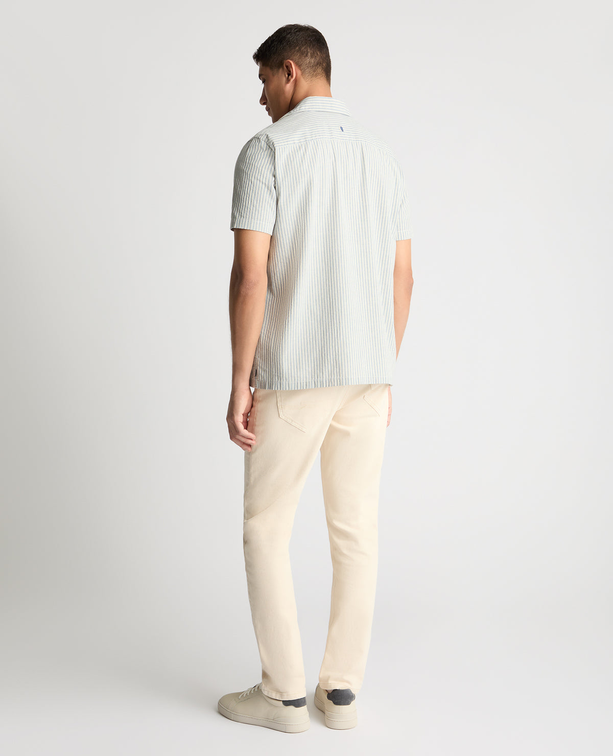 Man wearing a blue casual shirt