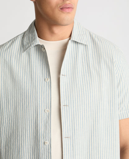 Man wearing a blue casual shirt