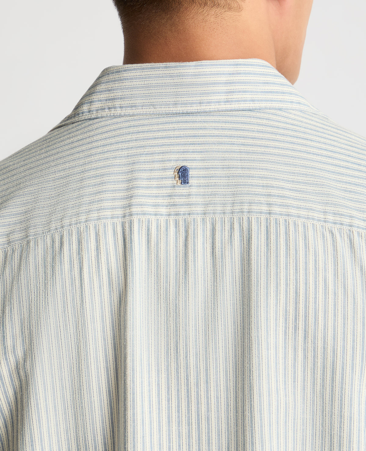 Man wearing a blue casual shirt