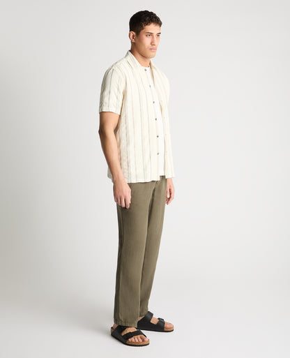 Man wearing a cream casual shirt