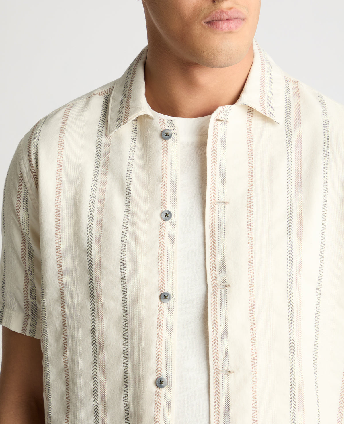 Man wearing a cream casual shirt