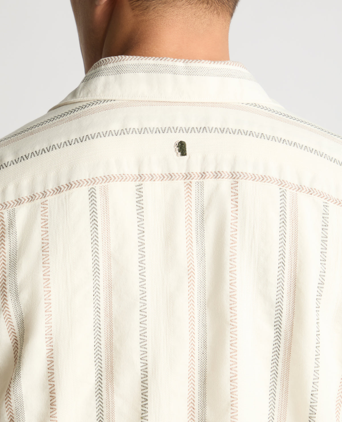 Man wearing a cream casual shirt