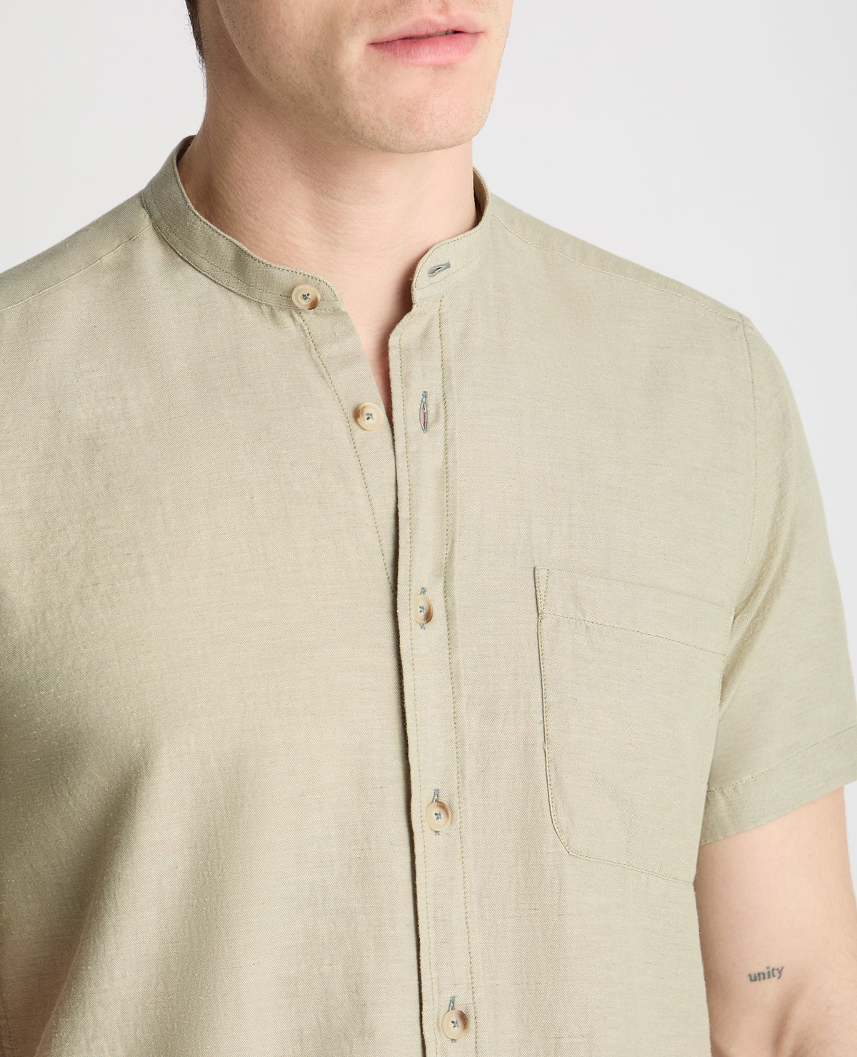 Man wearing a green casual shirt