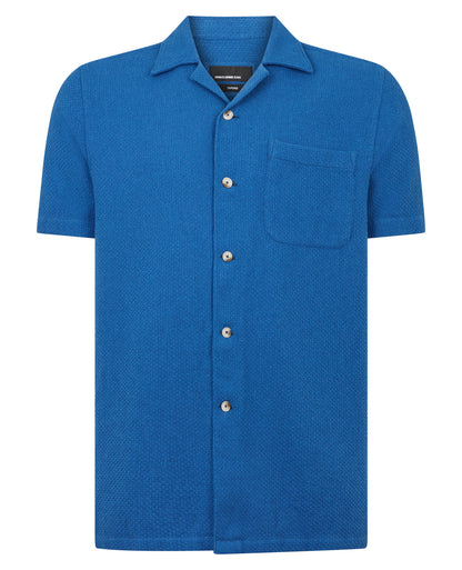 Man wearing a blue casual shirt