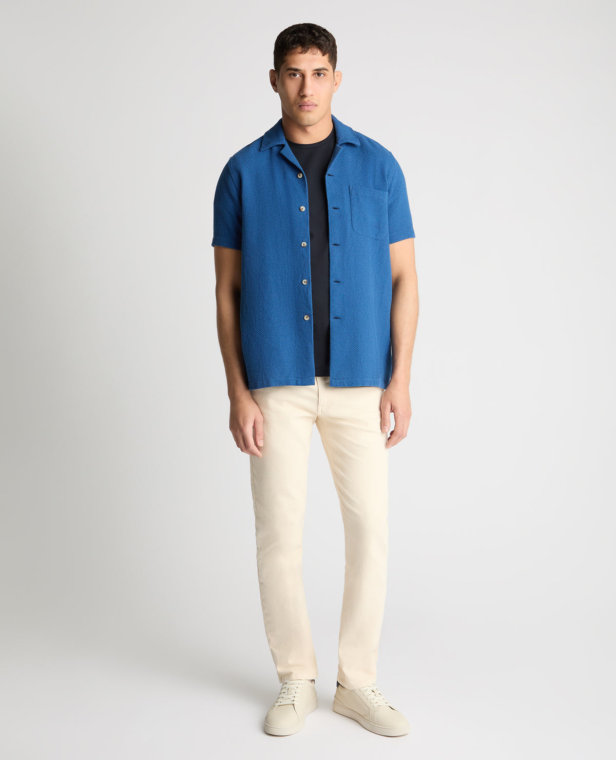 Man wearing a blue casual shirt