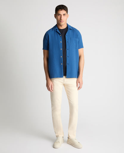 Man wearing a blue casual shirt