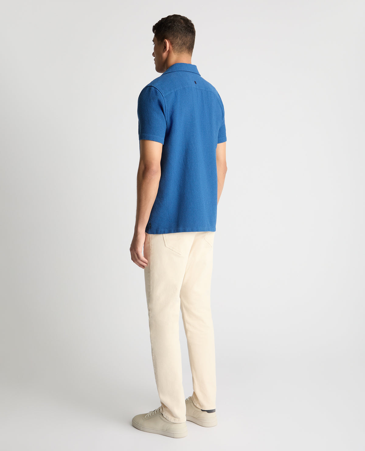 Man wearing a blue casual shirt