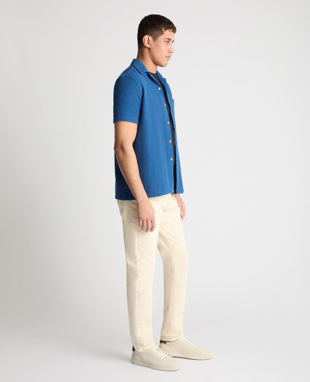 Man wearing a blue casual shirt