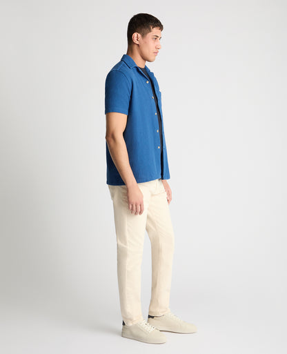Man wearing a blue casual shirt