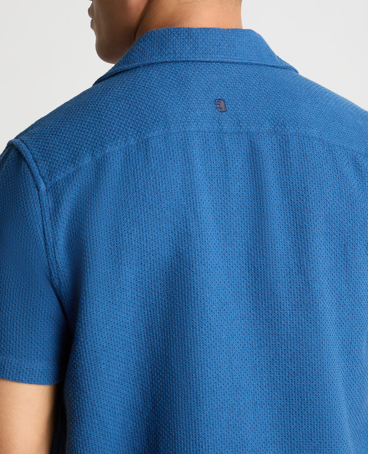 Man wearing a blue casual shirt