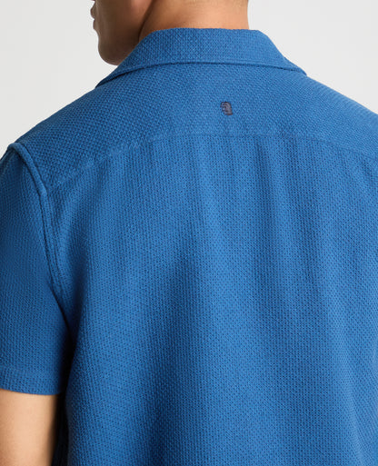 Man wearing a blue casual shirt