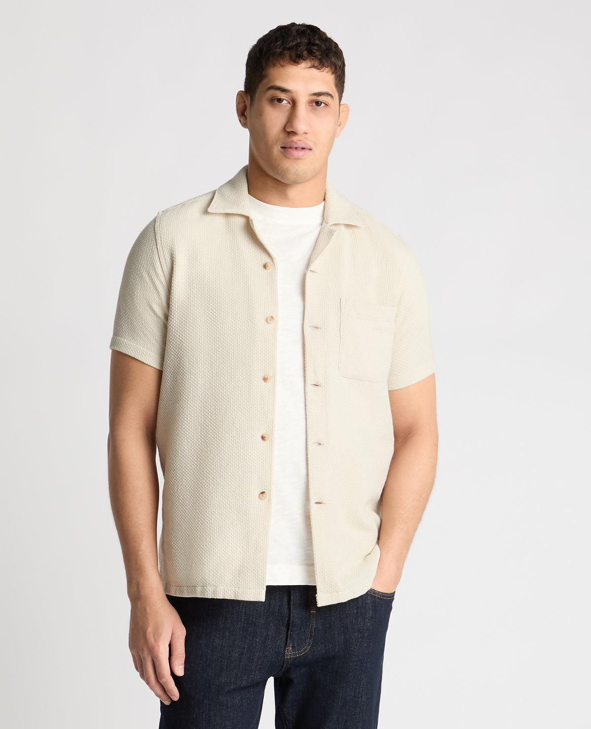 Man wearing a cream casual shirt