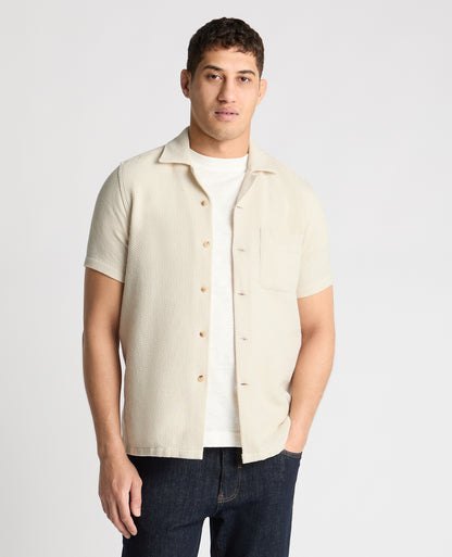 Man wearing a cream casual shirt