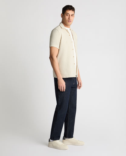 Man wearing a cream casual shirt