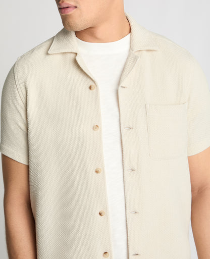 Man wearing a cream casual shirt