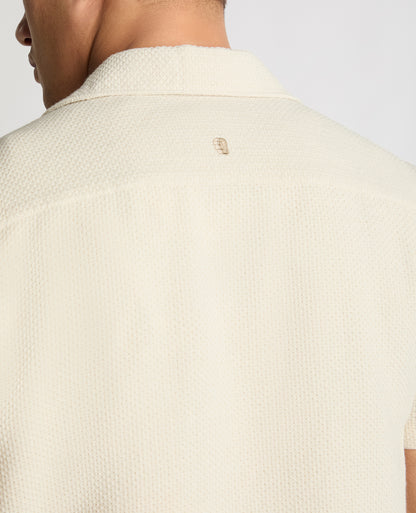 Man wearing a cream casual shirt