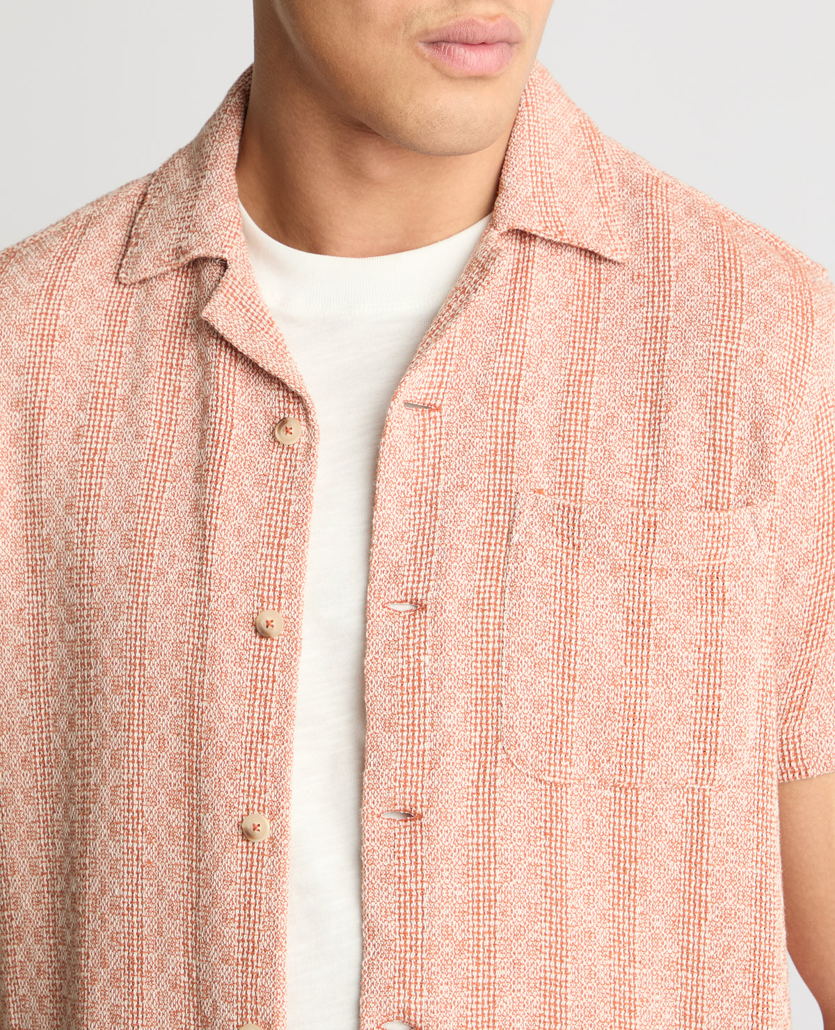 Man wearing a orange casual shirt