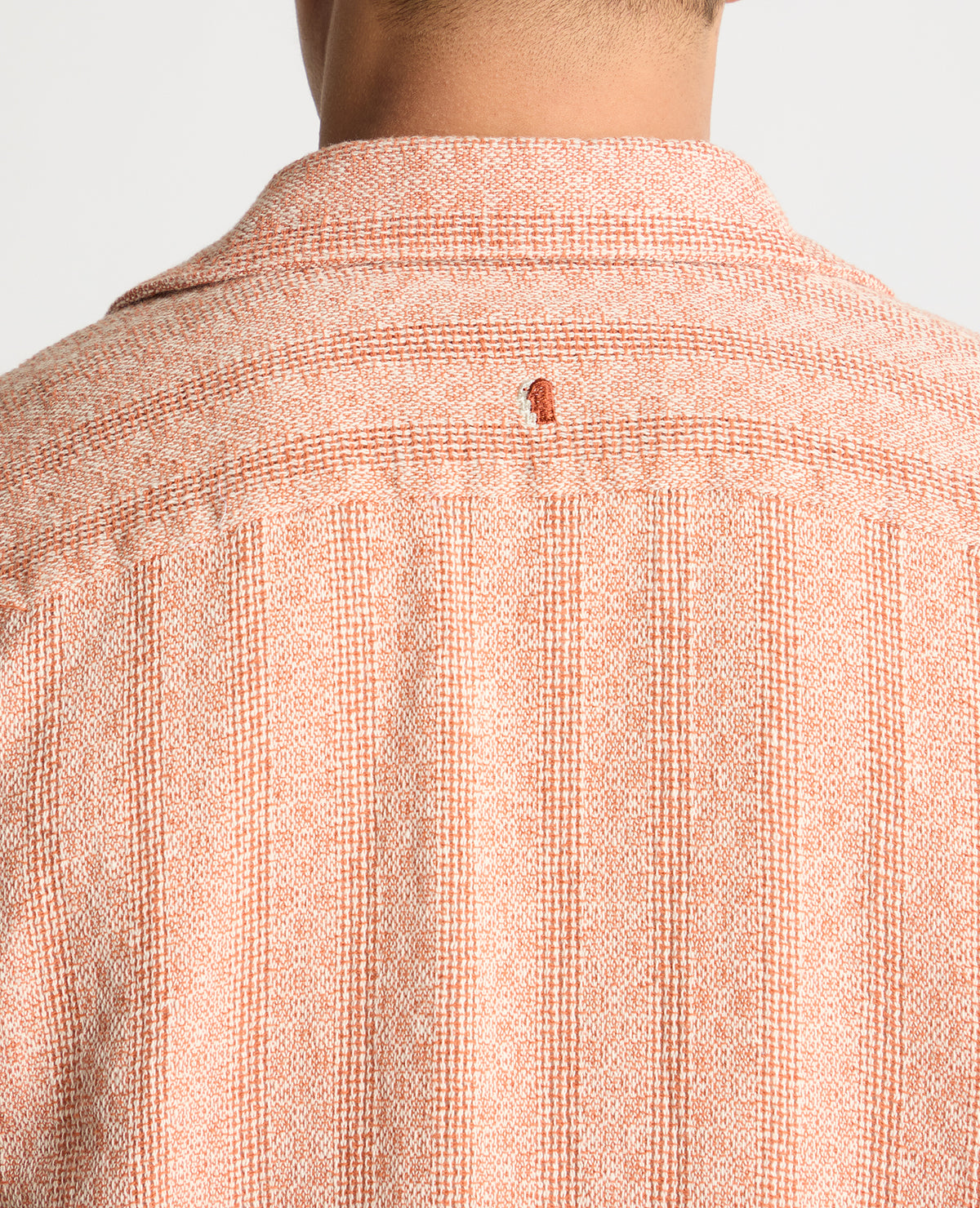 Man wearing a orange casual shirt