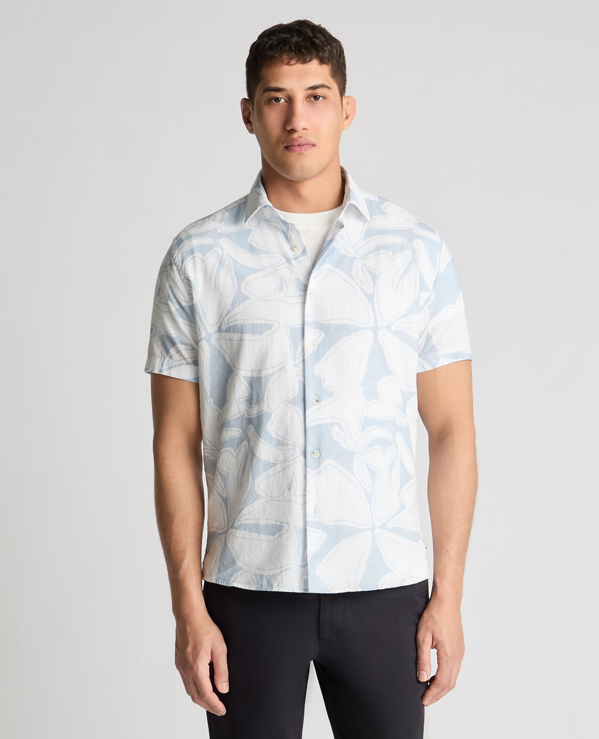 Man wearing a blue casual shirt