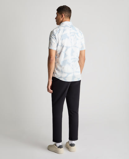 Man wearing a blue casual shirt