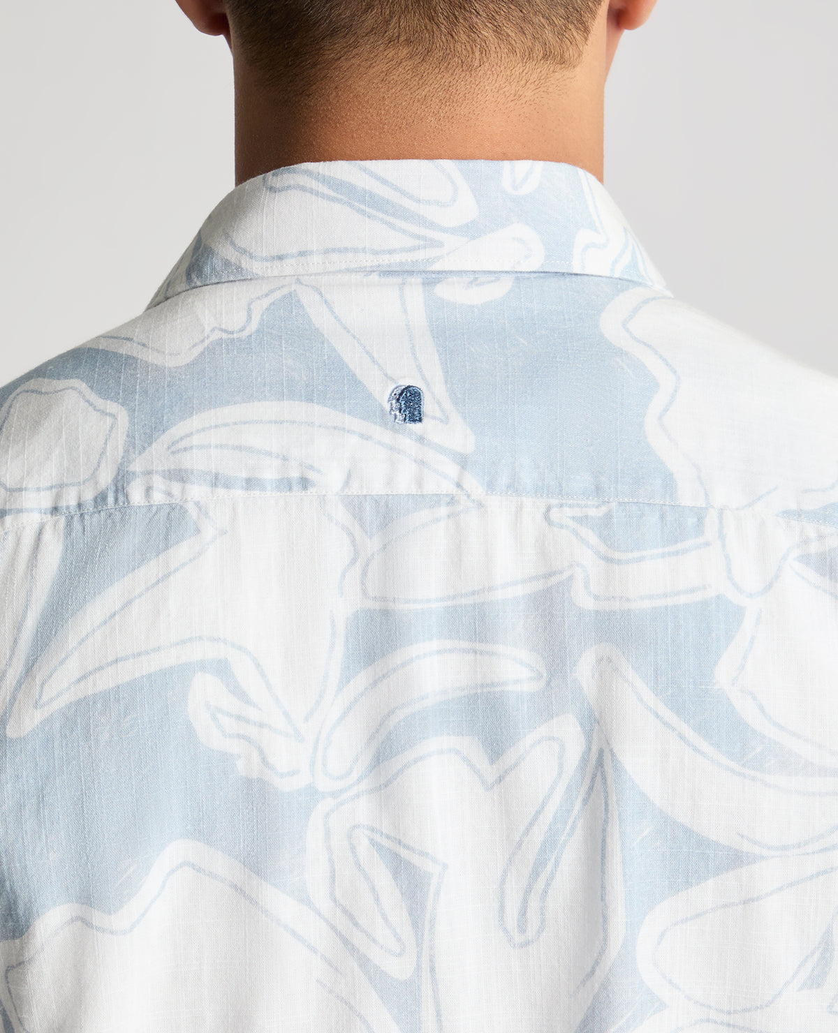 Man wearing a blue casual shirt