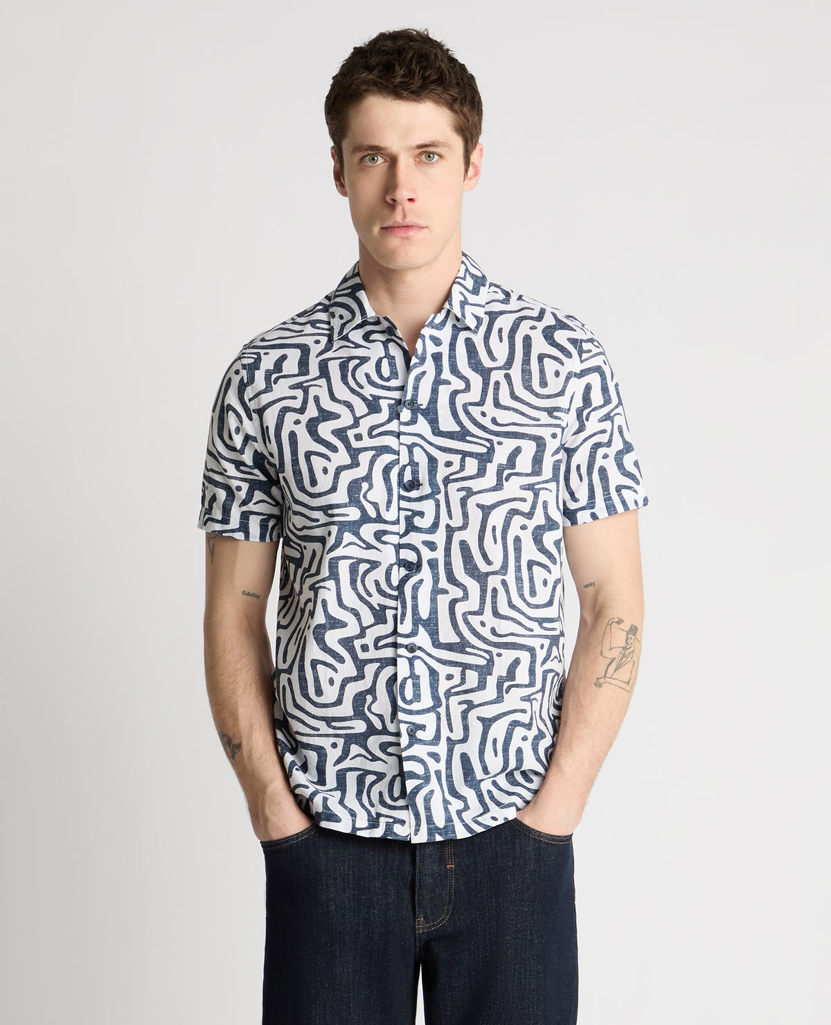Man wearing a white and navy casual shirt