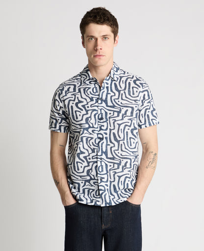 Man wearing a white and navy casual shirt