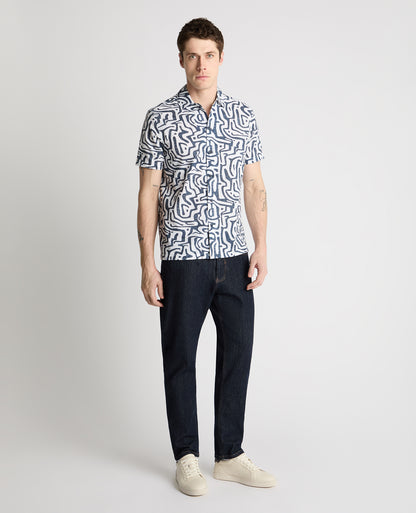 Man wearing a white and navy casual shirt
