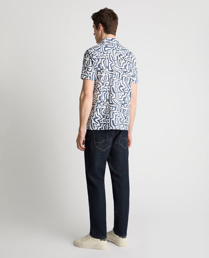 Man wearing a white and navy casual shirt