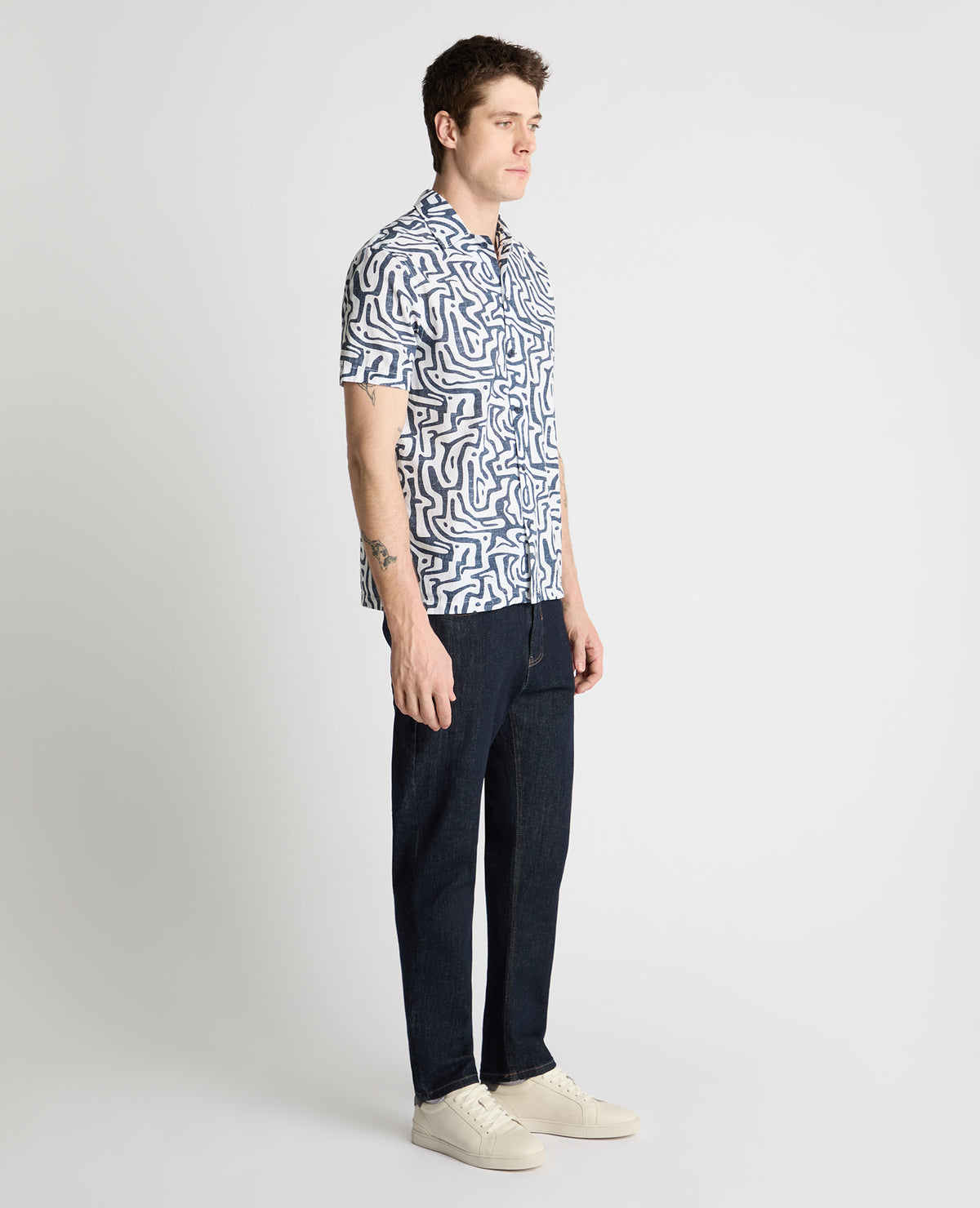 Man wearing a white and navy casual shirt