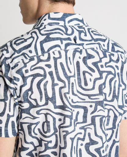 Man wearing a white and navy casual shirt