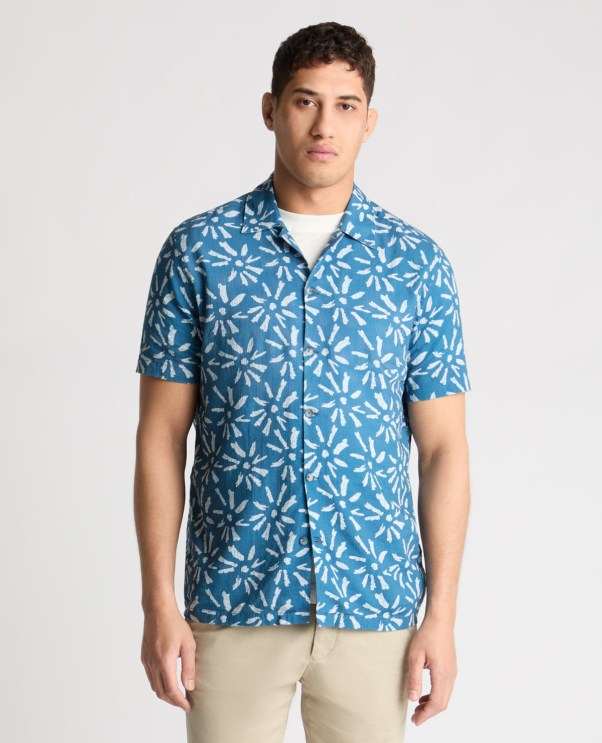 Man wearing a blue casual shirt