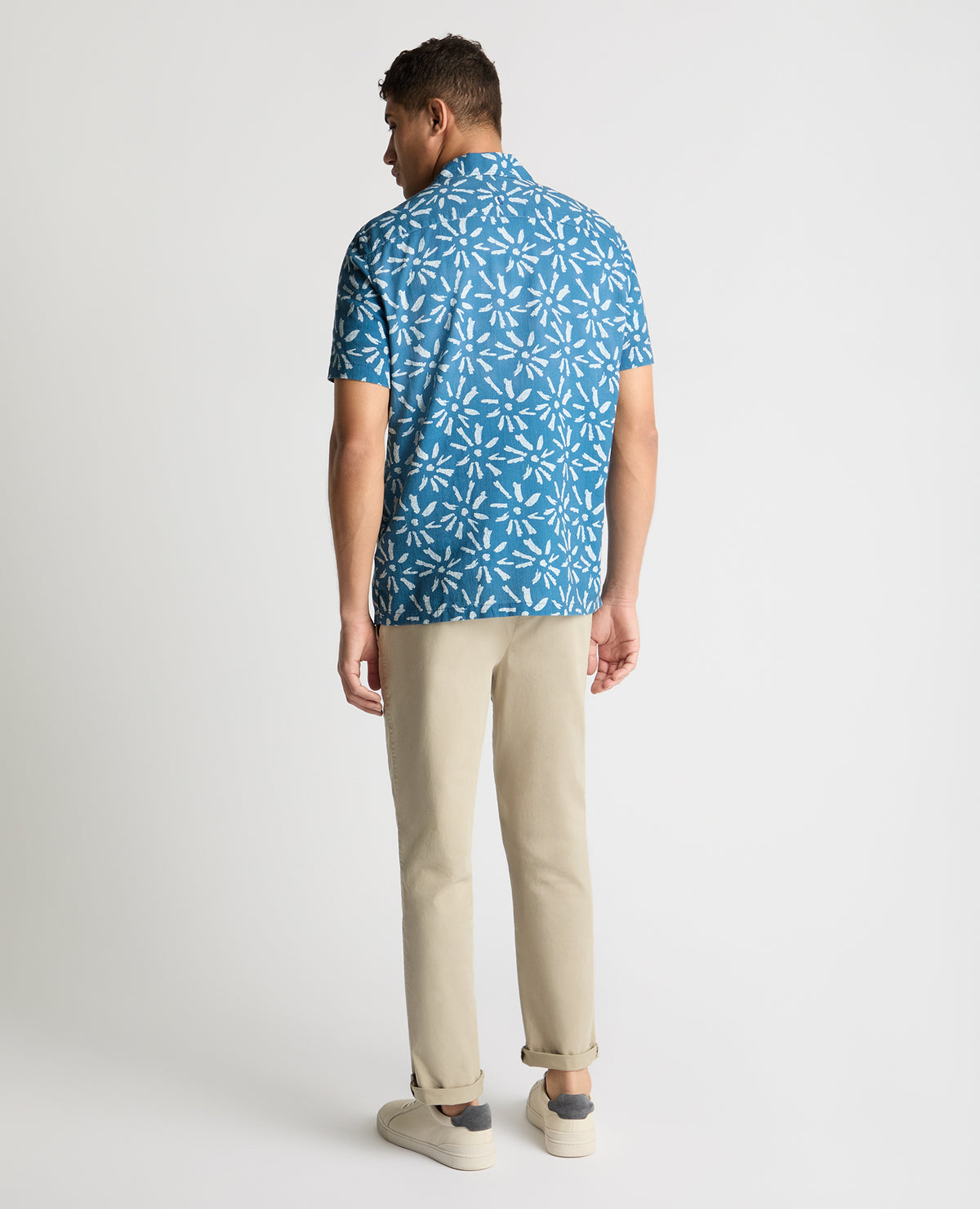 Man wearing a blue casual shirt