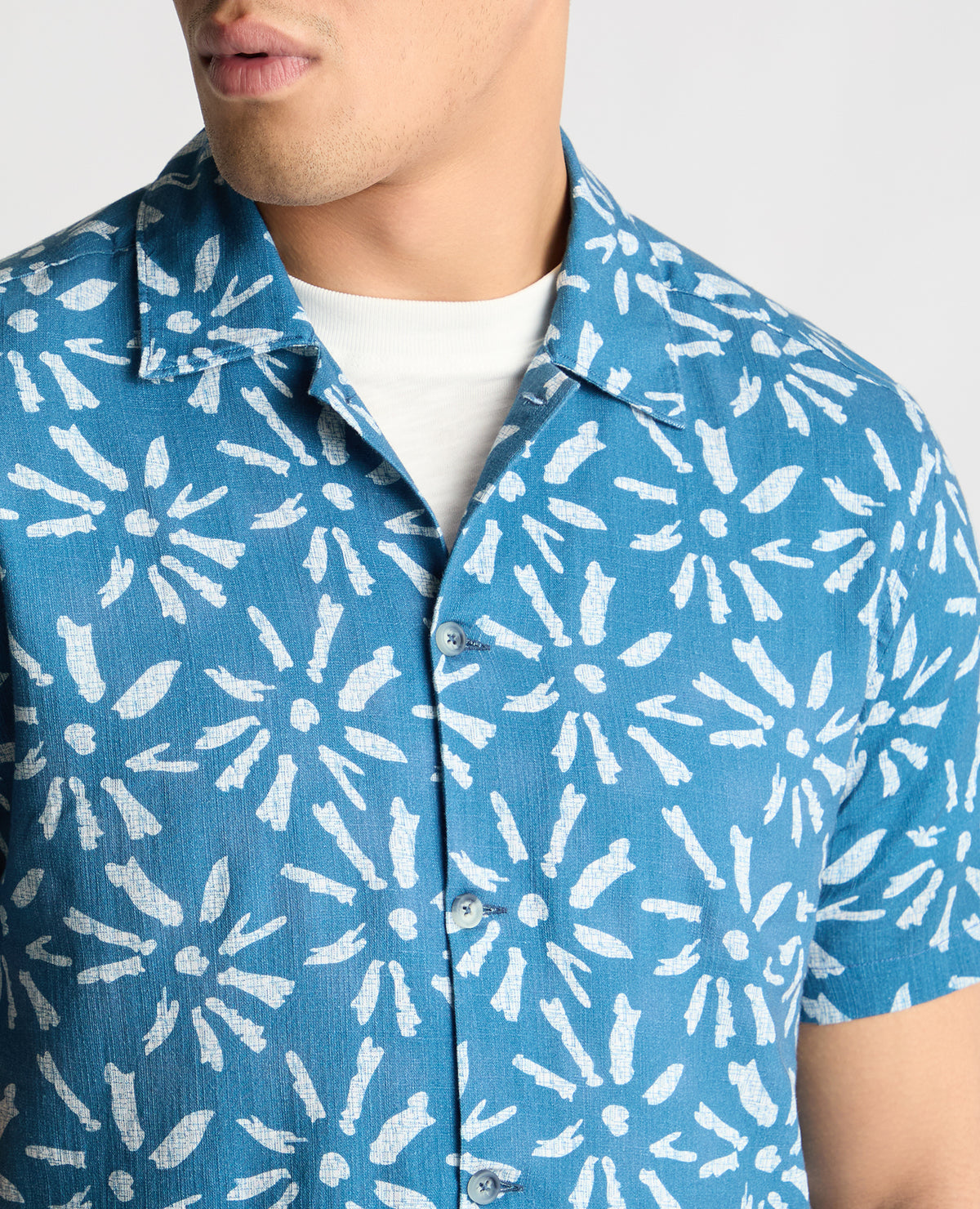 Man wearing a blue casual shirt