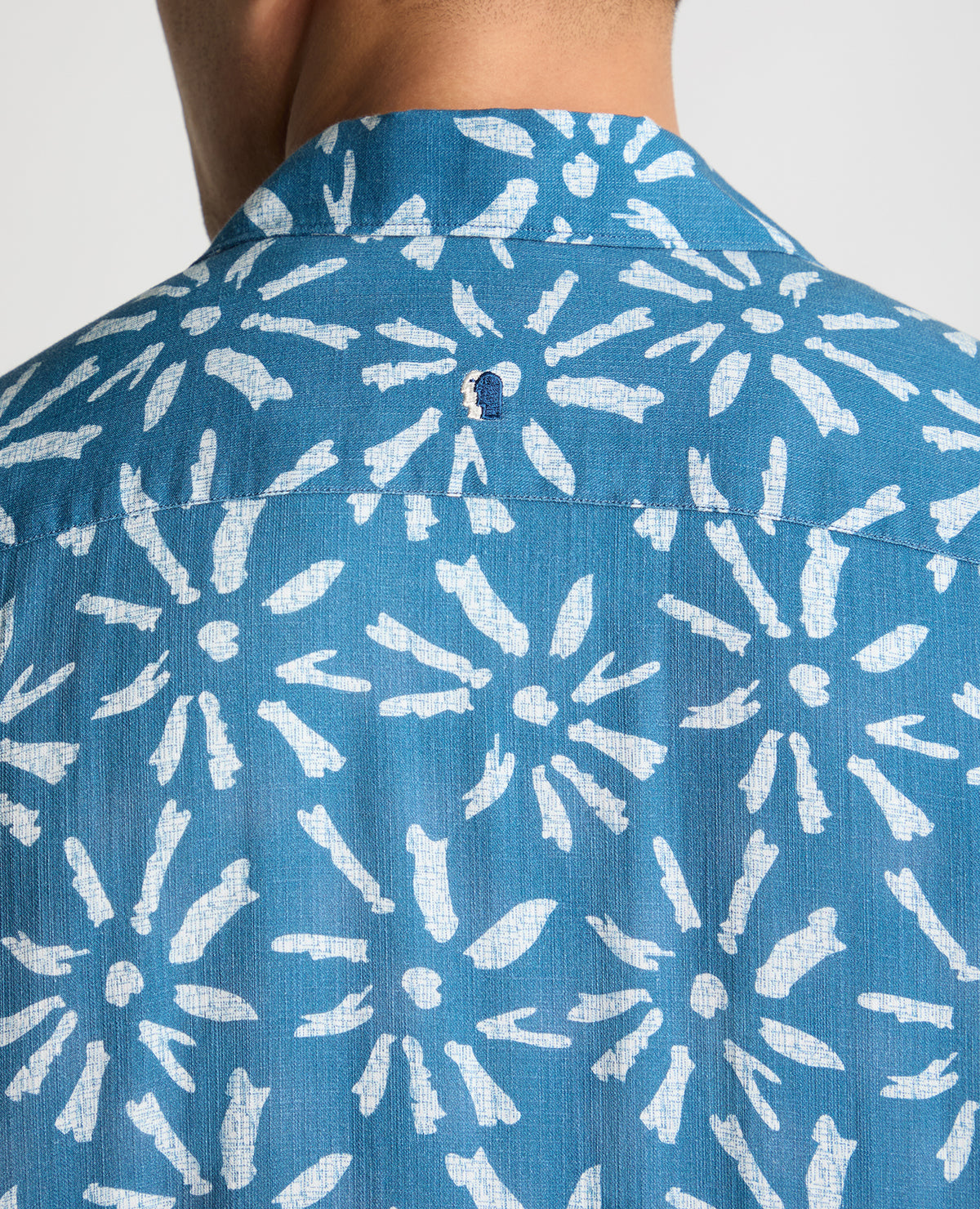 Man wearing a blue casual shirt