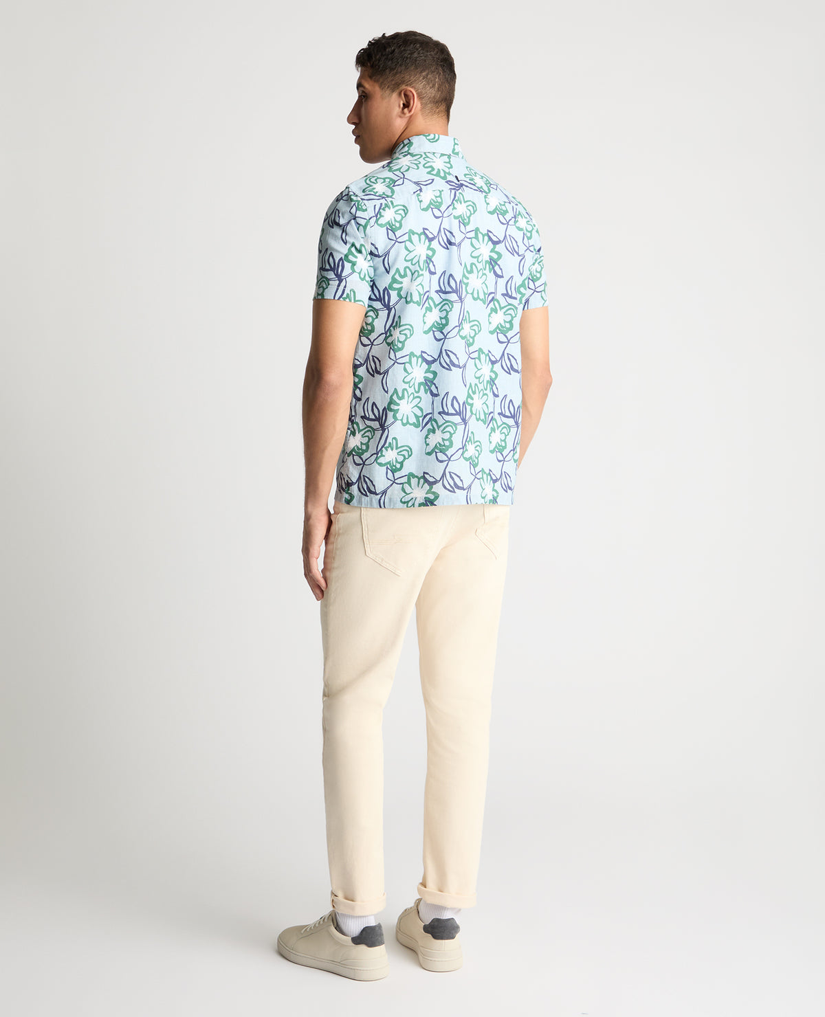 Man wearing a blue casual shirt