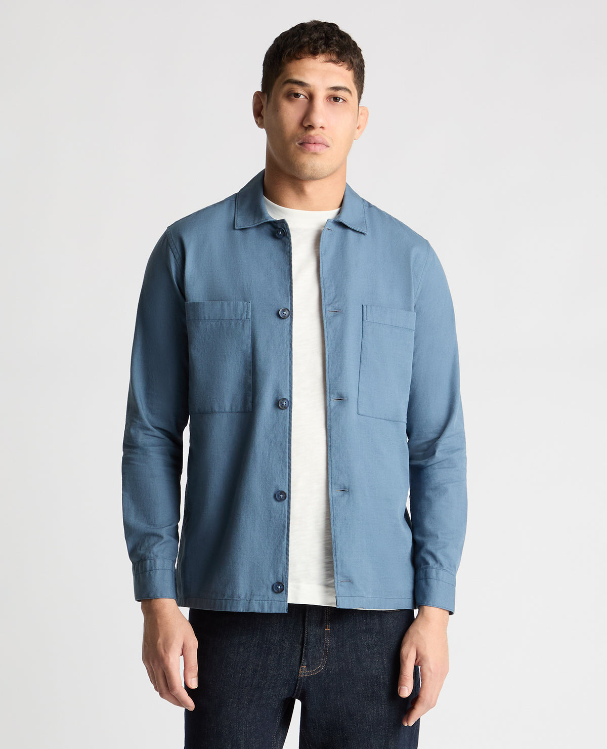 Man wearing a blue casual shirt