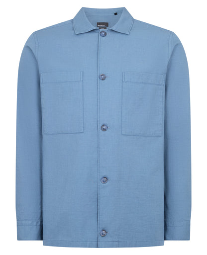 Man wearing a blue casual shirt