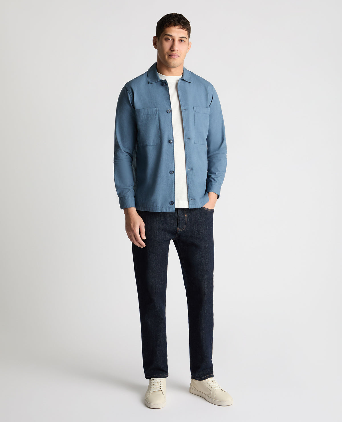 Man wearing a blue casual shirt