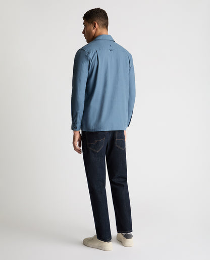 Man wearing a blue casual shirt