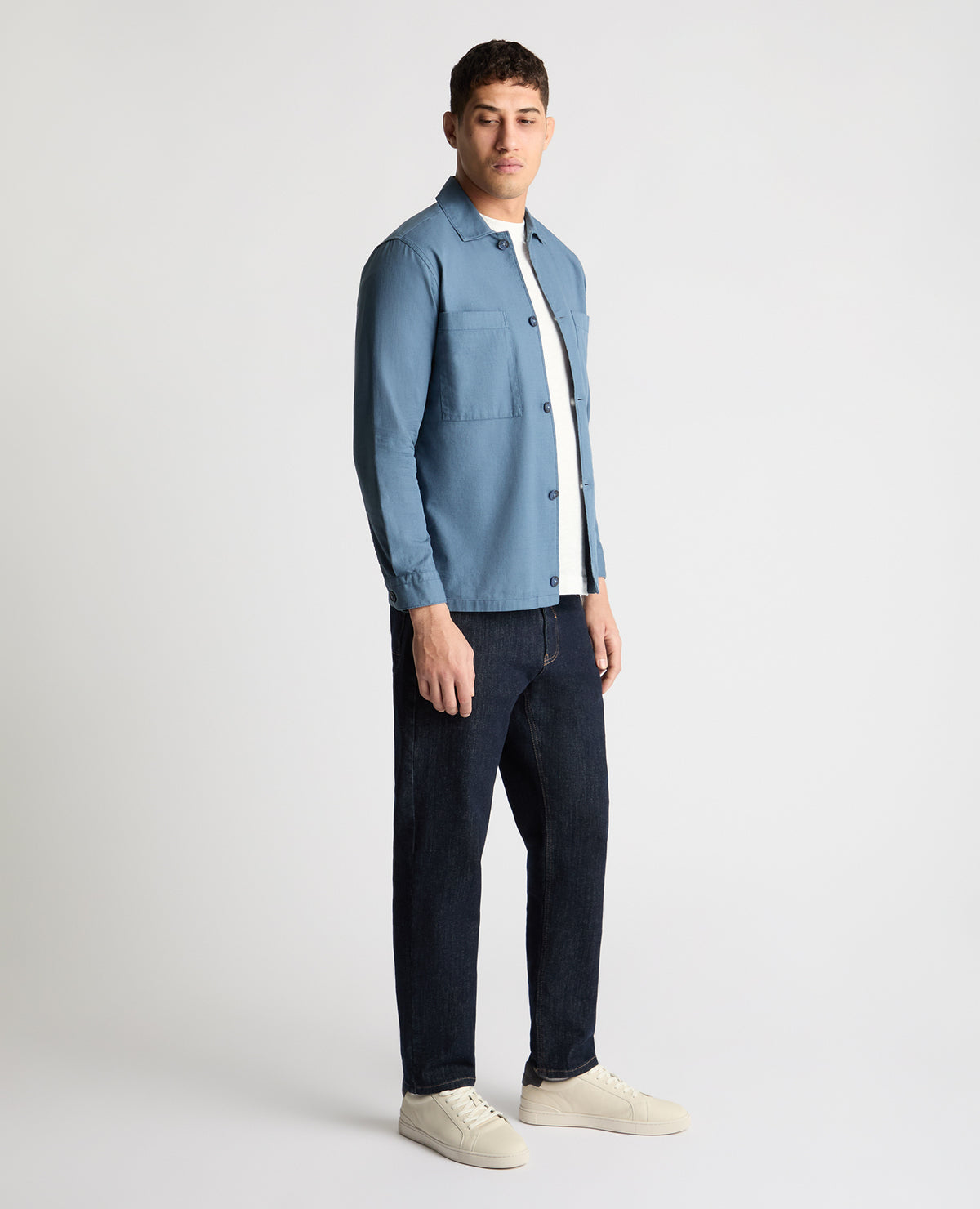 Man wearing a blue casual shirt
