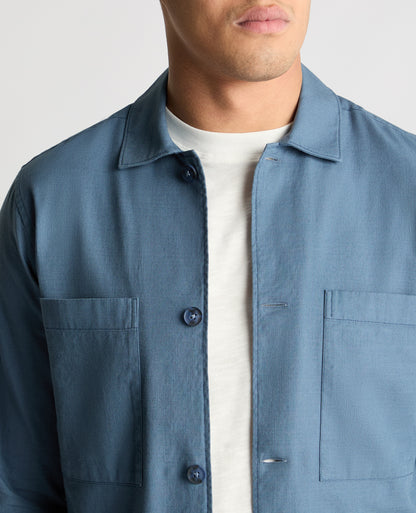 Man wearing a blue casual shirt