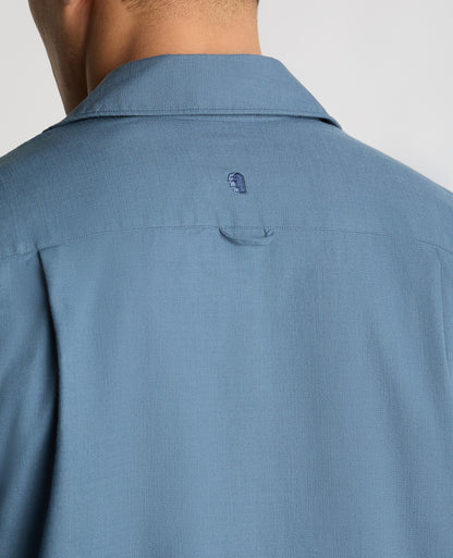 Man wearing a blue casual shirt