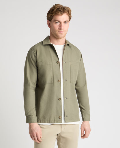 Man wearing a green casual shirt