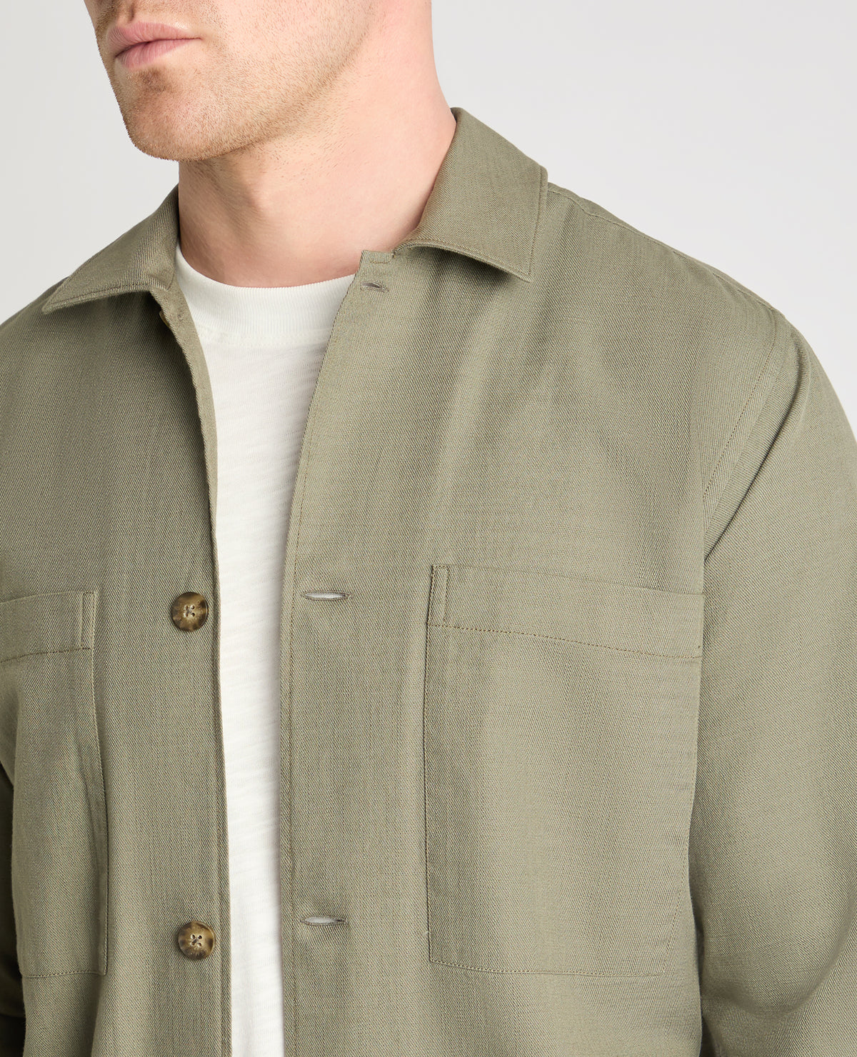 Man wearing a green casual shirt