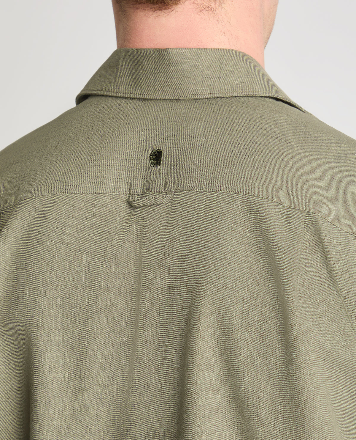 Man wearing a green casual shirt