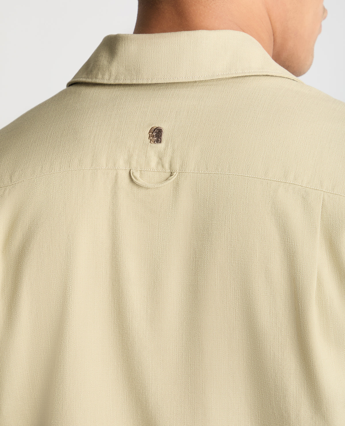 Man wearing a stone casual shirt
