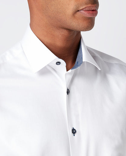 Man wearing a white Tapered Fit Cotton-Blend Satin Shirt