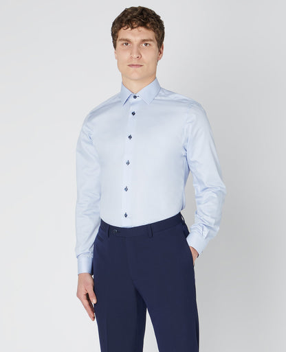 Man wearing a blue Tapered Fit Cotton-Blend Satin Shirt