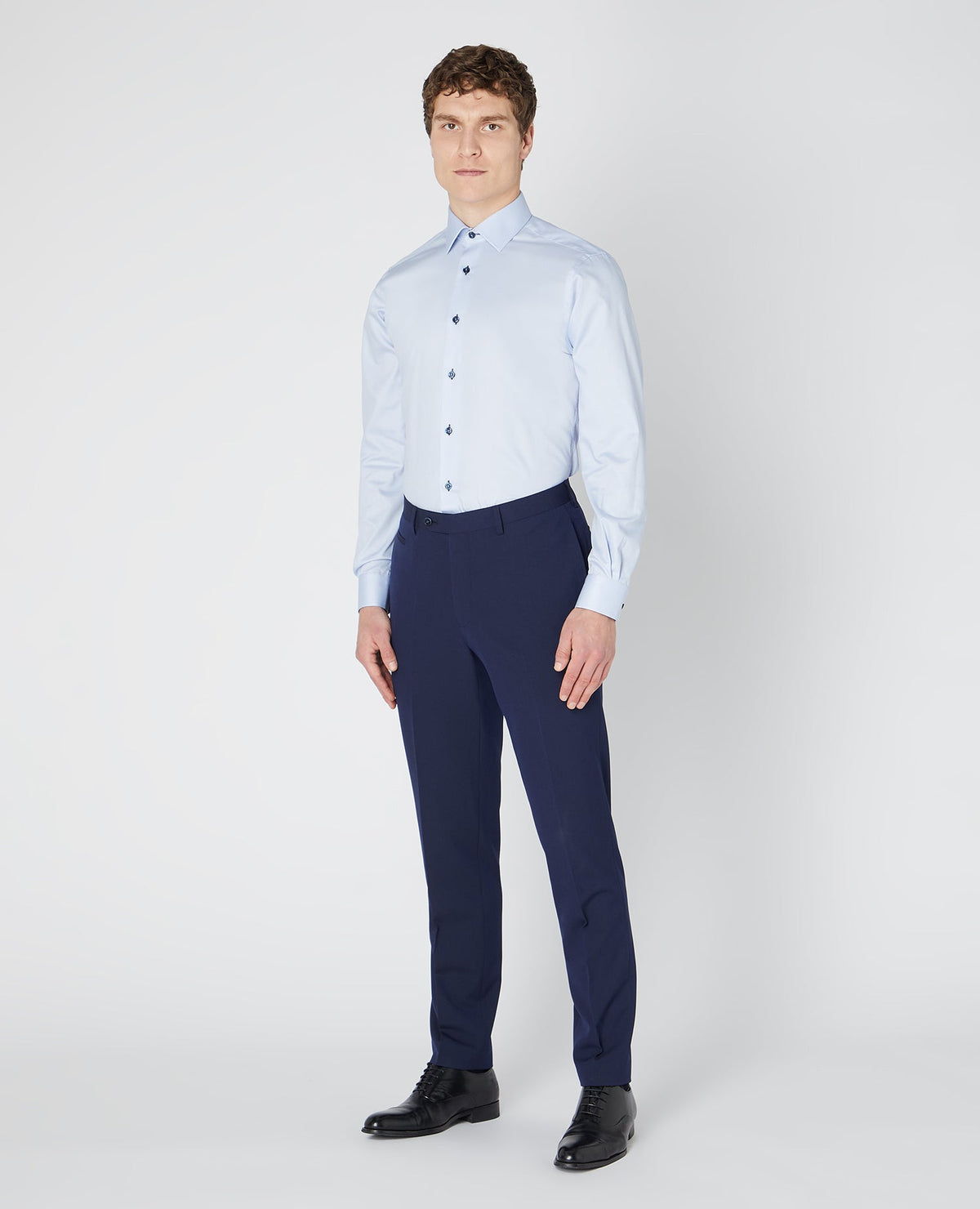 Man wearing a blue Tapered Fit Cotton-Blend Satin Shirt